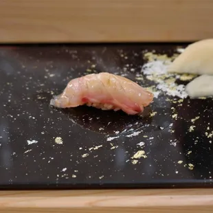 the ingredients of a sushi on a cutting board