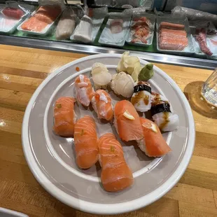 3 salmon sushi, 2 fatty salmon, 2 smoked salmon, 2 seared scallop, and 2 octopus sushi