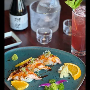 Seared salmon nigiri, house sake and cocktail.