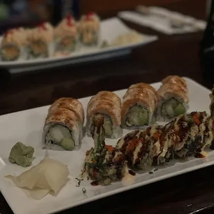 a plate of sushi rolls