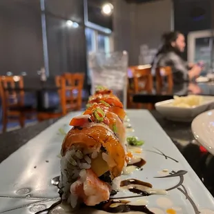 a sushi roll on a white plate