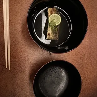 a plate of food and chopsticks