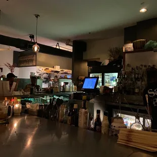 a view of a bar with a laptop on the counter