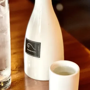 a pitcher and a glass of water on a table