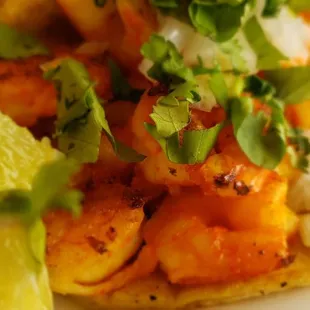 a taco with shrimp and vegetables