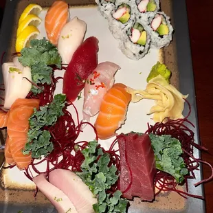 a platter of sushi and rolls