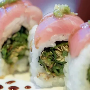 Kirala roll-yellowtail sashimi with soy sautéed shishito pepper and balsamic truffle sauce.