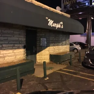 a car parked in front of a restaurant