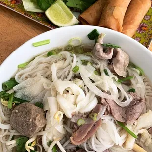 Combination pho (i substitute tendon for tripe) With a side of egg rolls.