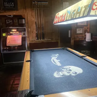 a pool table and arcade machines