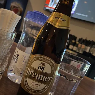 a bottle of beer sitting on a table