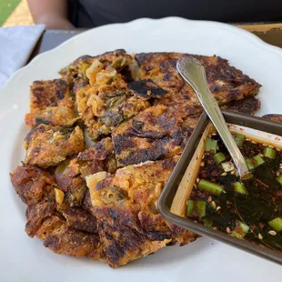 Kimchi pancake. Was slightly burnt and it took forever to be served. Served this 30 mins after the chicken buns. Unbelievable!