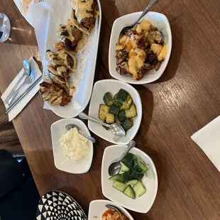 dak buns with variety of banchan (sides)