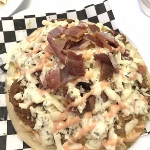 Colombian arepa with shredded beef and bacon