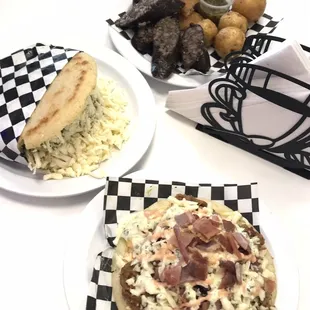 Lunch - clockwise - Venezuelan chicken arepa, morcilla with potatoes and fried arepa, and Colombian arepa with shredded beef