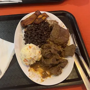 a plate of food on a tray