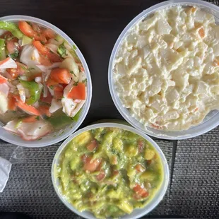 Ceviche, avocado salad, potato salad.