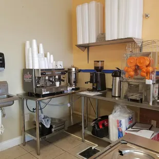 a coffee bar with stainless steel counter tops