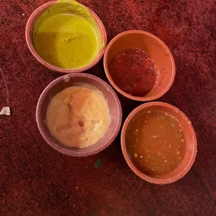 four bowls of sauce