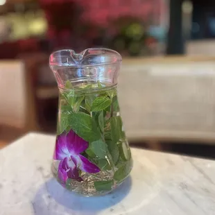  a flower in a glass vase