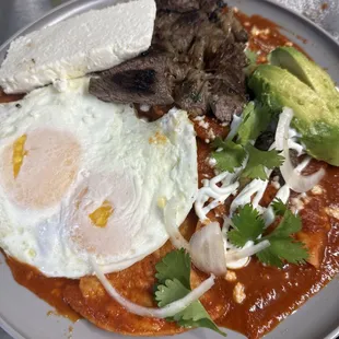 Spicy, savory, and everything in between - red sauce chilaquiles for the perfect breakfast bite!