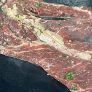 Let the flavors soak in. marinating carne asada for that perfect sizzle and taste.