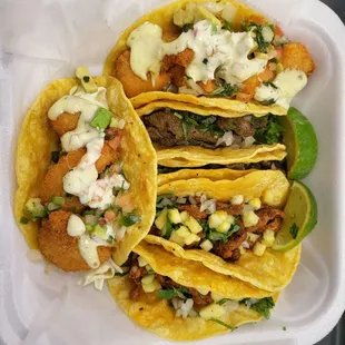 Shrimp, asada, and al pastor tacos.