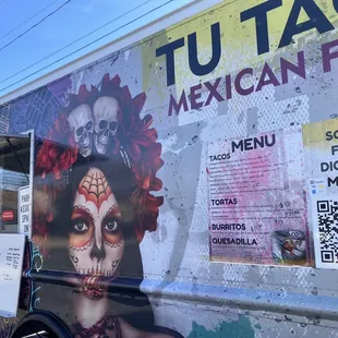 a mexican food truck parked on the side of the road