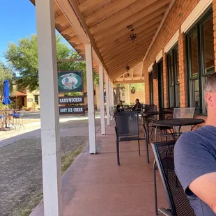 a man sitting on a porch
