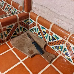 Used steak knife and cutting board in the bathroom