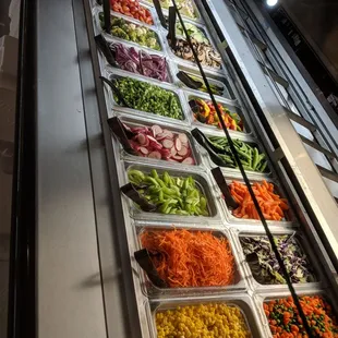 a variety of salads on display