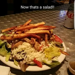 a plate of salad and fries