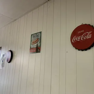 a coca cola sign on the wall