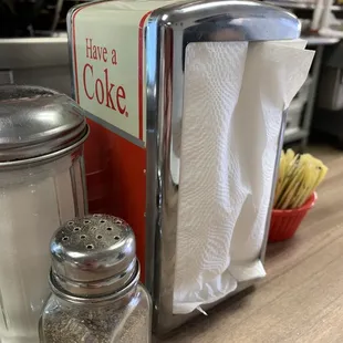 a coke dispenser and salt shaker