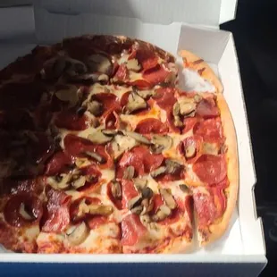 Medium size pepperoni and mushroom pizza.
