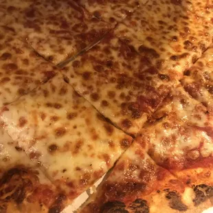 a cheese pizza cut into slices