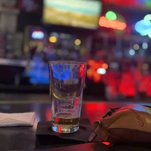 a glass of beer and a mouse