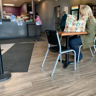 a woman sitting at a table