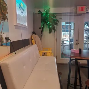 The beach vibe lounge area with a led palm tree