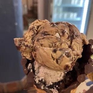 Almond mocha and cookie and creams on a chocolate dipped waffle cone