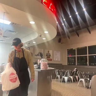 a man carrying a bag of food
