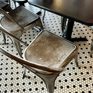 I hate these damned metal chairs.