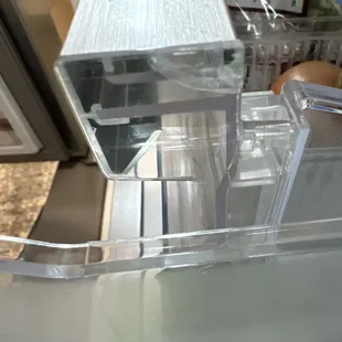 The piece someone glued on to the drawer