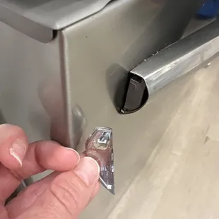 Glued on piece of Fridge handle- after me complaining multiple times it was finally replaced