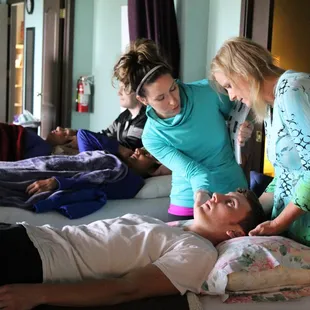 Anna Marie Blessing, B.Msc teaching a Healing workshop to 20 of her clients.