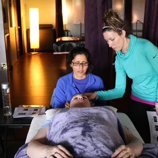 Anna Marie Blessing, B.Msc teaching a Healing workshop to 20 of her clients.
