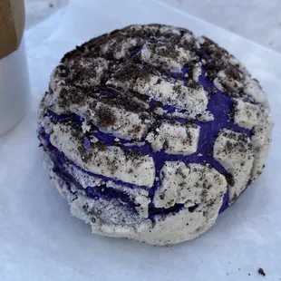 Absolutely fantastic Ube concha sprinkled with Oreo dust.