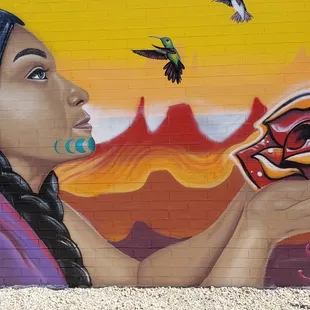Tucson Computer mural depicting indigenous woman with birds and flowers