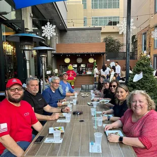 The group eating carne seca pizza at The Monica!