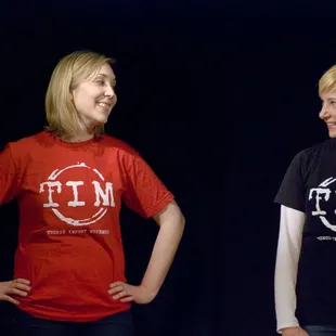a woman and a man standing next to each other